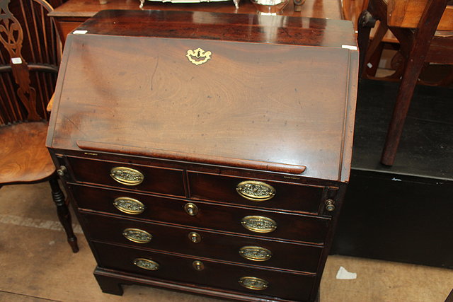 Appraisal: AN TH CENTURY MAHOGANY BUREAU the sloping front opening to