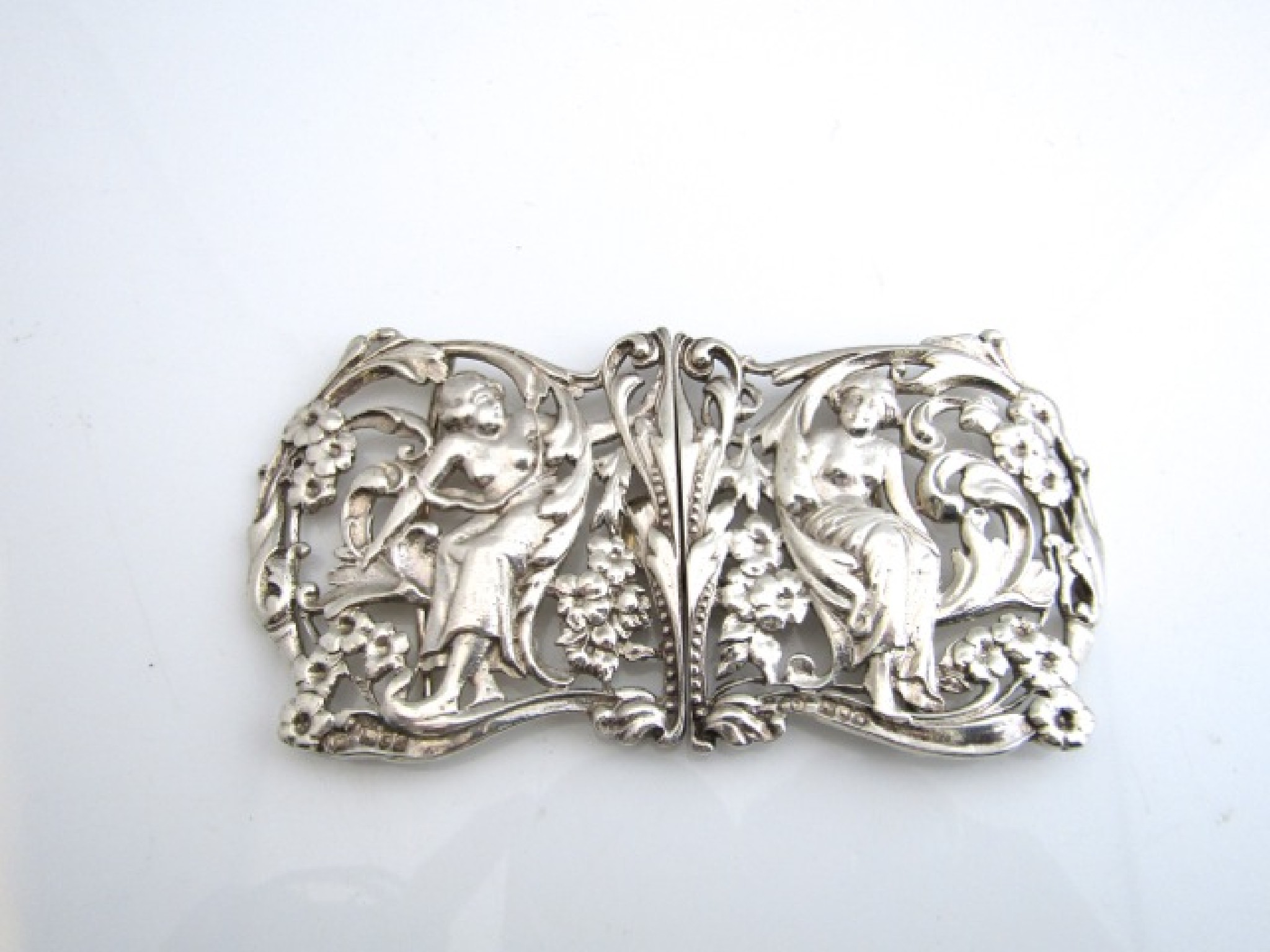 Appraisal: An Edwardian silver belt buckle William Comyns Sons London composed