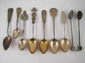 Appraisal: Seven Chinese white metal spoons and a pair of tongs