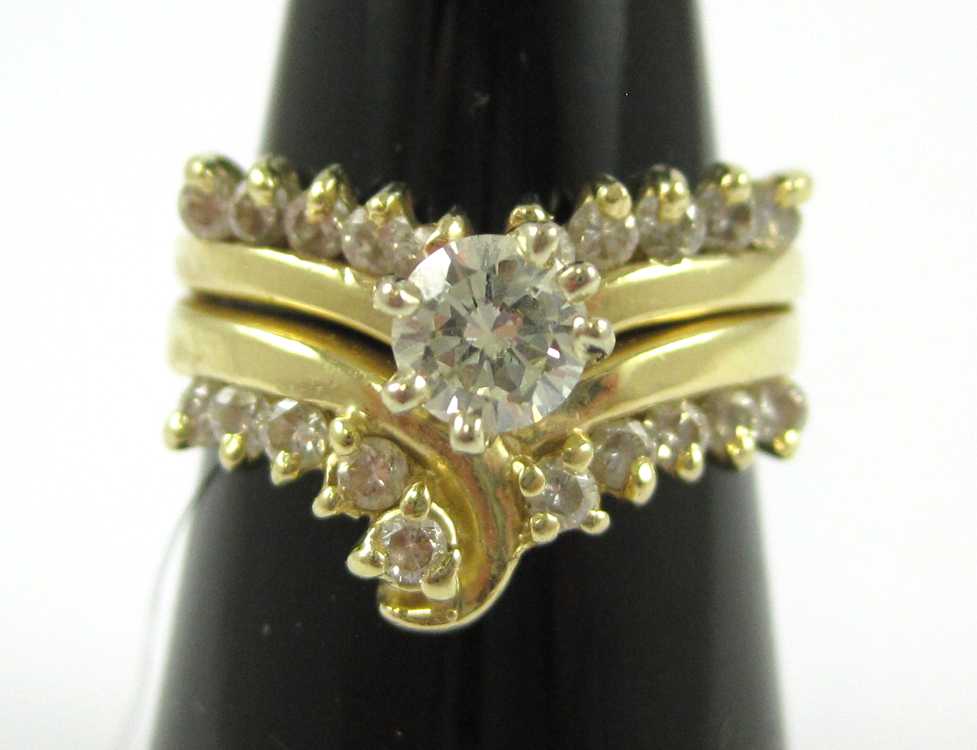 Appraisal: DIAMOND AND FOURTEEN KARAT GOLD RING with ten round-cut diamonds