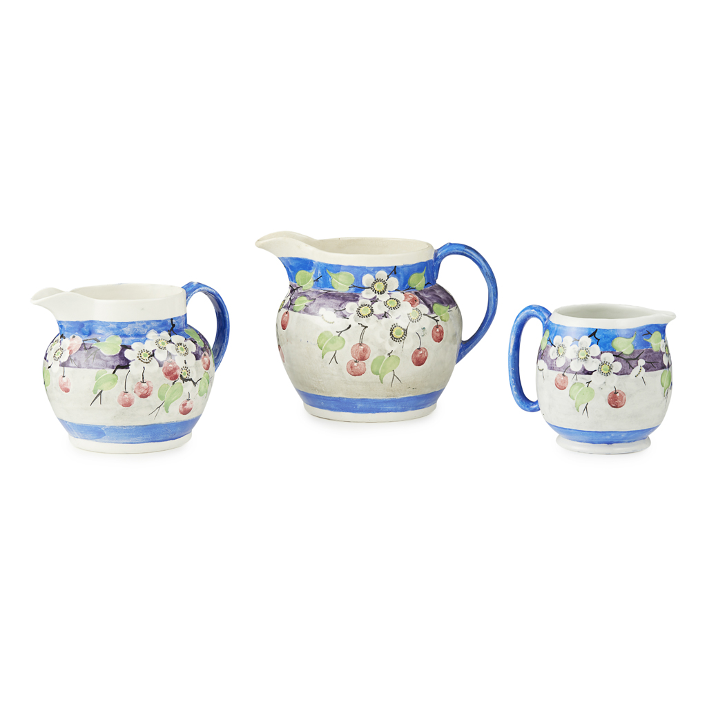 Appraisal: THREE MAK' MERRY POTTERY JUGS CIRCA each painted with flowering