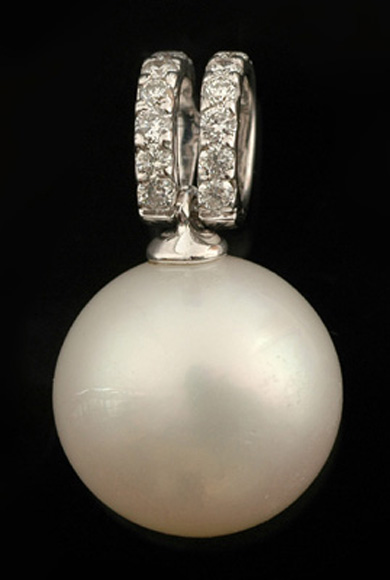 Appraisal: A South Sea pearl and diamond pendant The round pearl