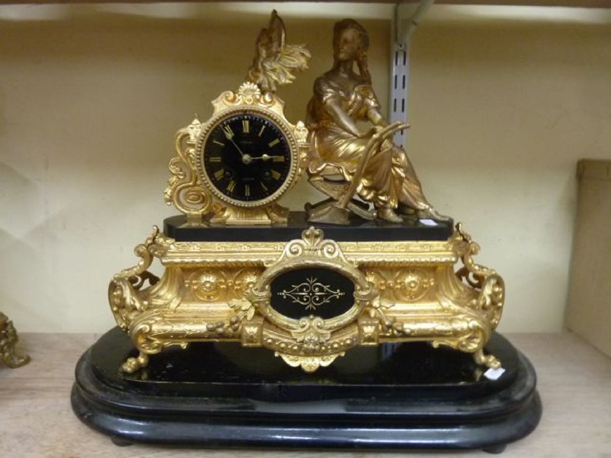 Appraisal: A substantial Victorian gilded mantle clock with marble plinth and