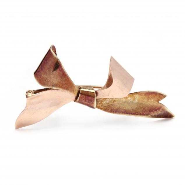 Appraisal: RETRO BI-COLOR GOLD BOW BROOCH Designed in yellow and rose