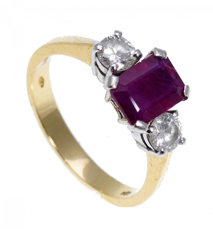 Appraisal: A RUBY AND DIAMOND THREE-STONE RING the larger step cut