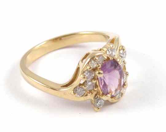 Appraisal: AMETHYST AND DIAMOND RING k yellow gold with twelve round-cut