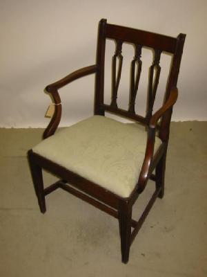 Appraisal: A MAHOGANY ELBOW CHAIR of Sheraton type curved top rail