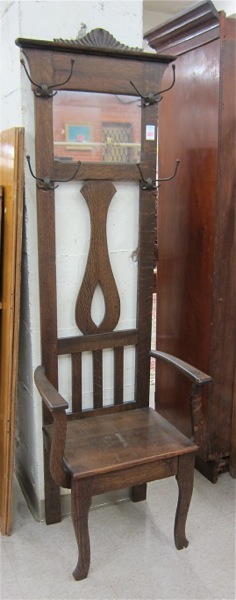 Appraisal: AN OAK CHAIR-BASE HALLSTAND American c featuring an armchair base