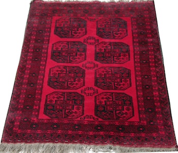 Appraisal: Turkomen Carpet Red wool on wool weft with black wool