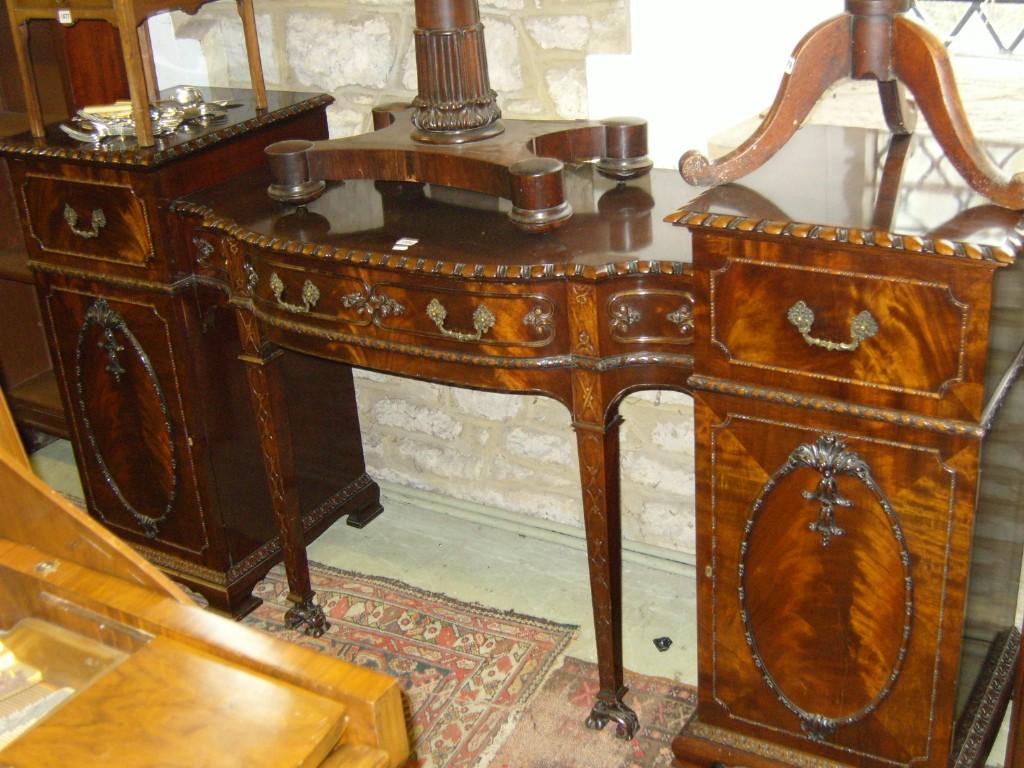 Appraisal: An Edwardian Chippendale style pedestal sideboard fitted with an arrangement