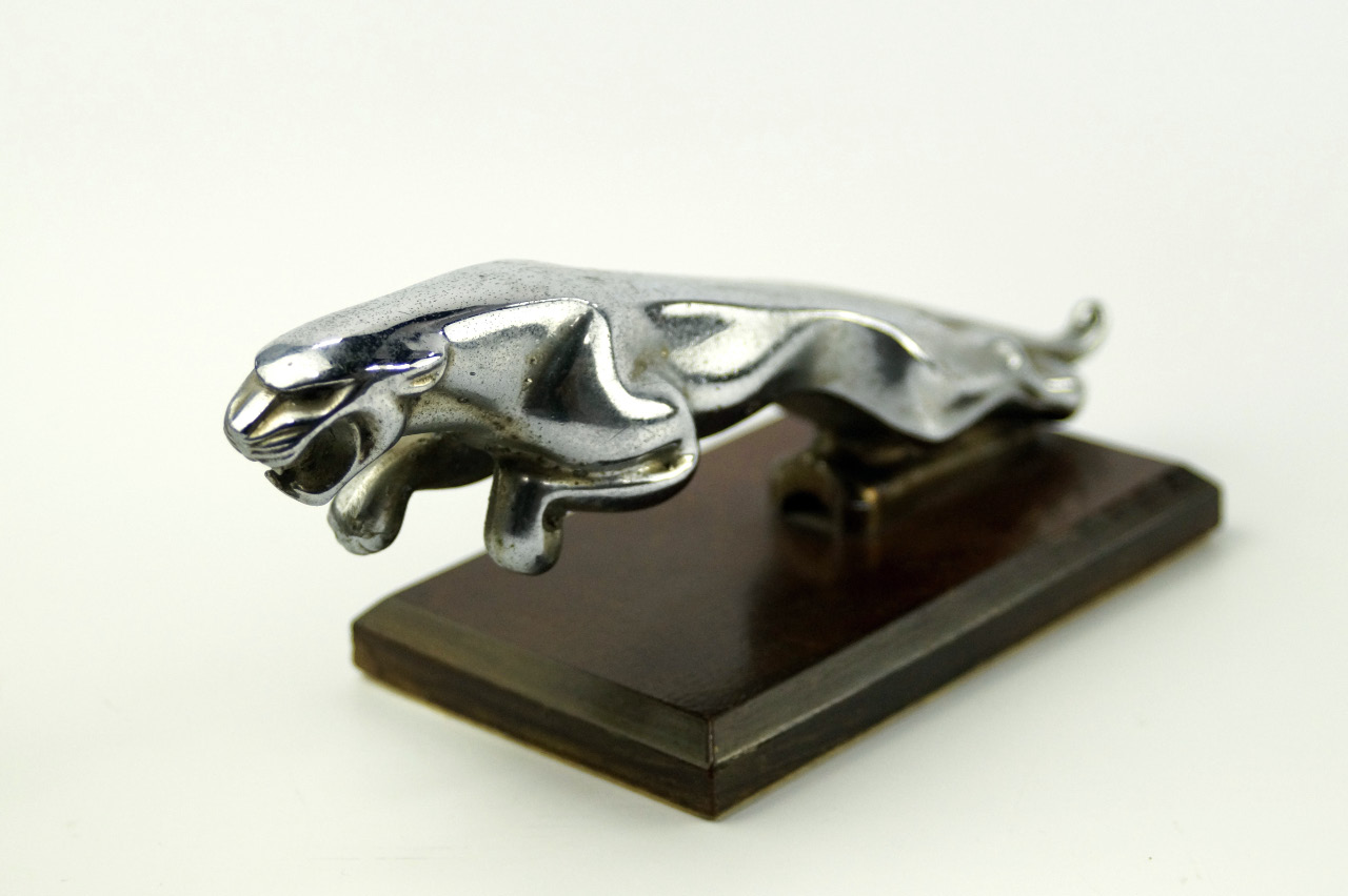 Appraisal: A mid 's Jaguar car mascot upon mahogany plinth cm