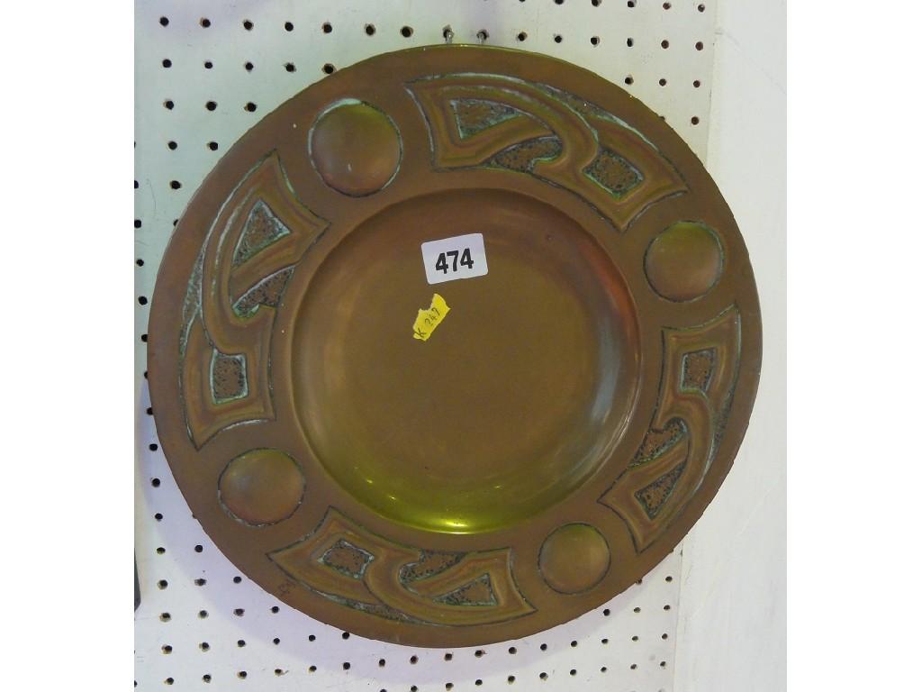 Appraisal: An Art Nouveau brass charger with celtic style patterned border