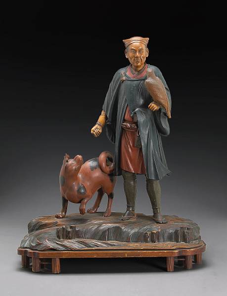 Appraisal: A painted wood study of a falconer and dog th