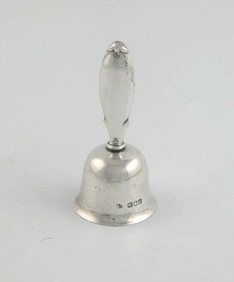 Appraisal: A late Victorian table bell with a shaped handle by