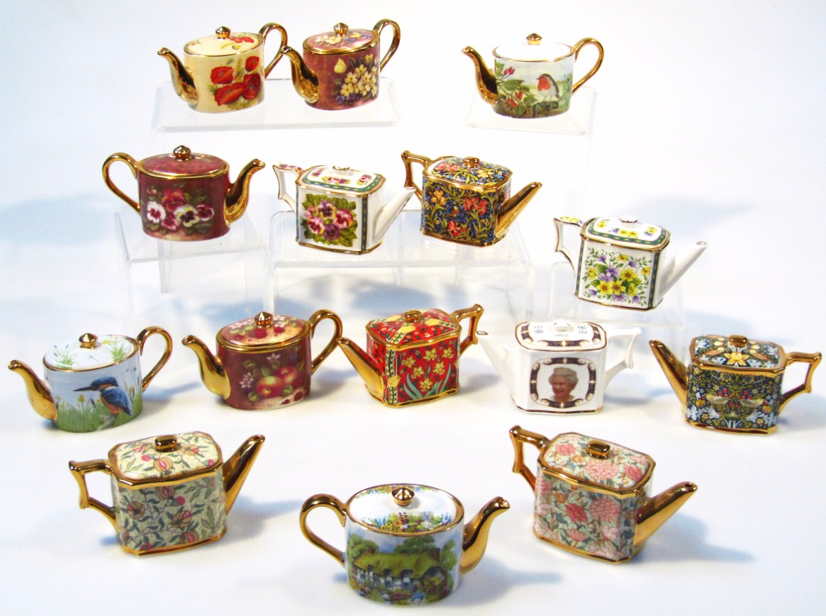 Appraisal: A large collection of Ayshford bone china miniature teapots to