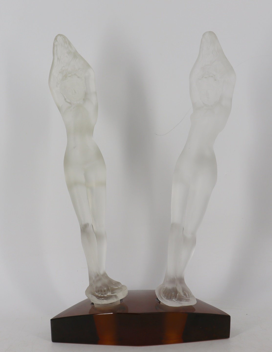 Appraisal: PAIR OF STEUBEN FROSTED GLASS DIVING WOMEN ON Amber glass