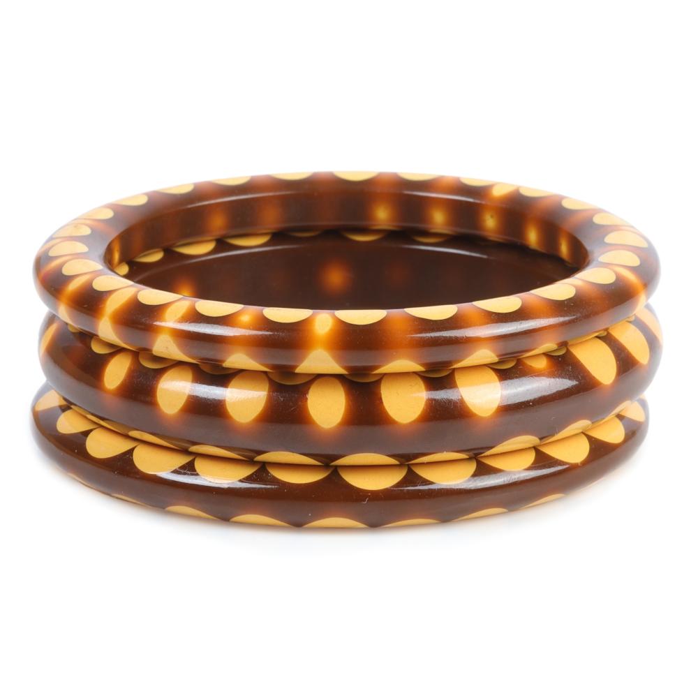 Appraisal: SET OF BROWN AND CREAM BAKELITE RANDOM DOT BANGLE BRACELETS