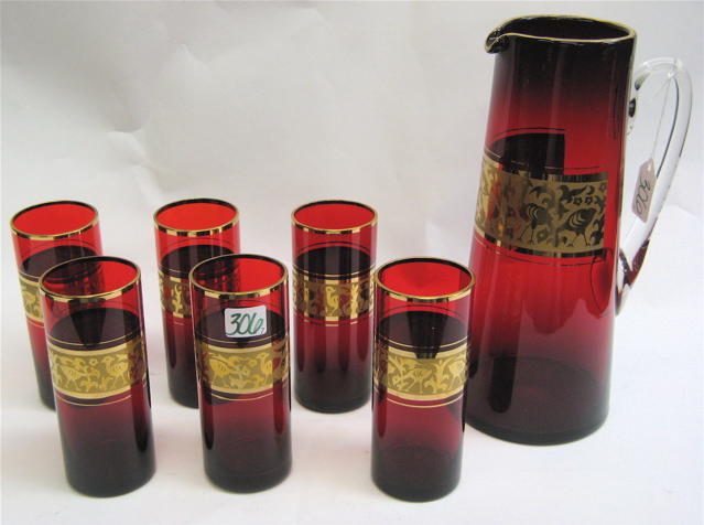 Appraisal: SEVEN PIECE RUBY RED AND GOLD DRINKS SET consisting of