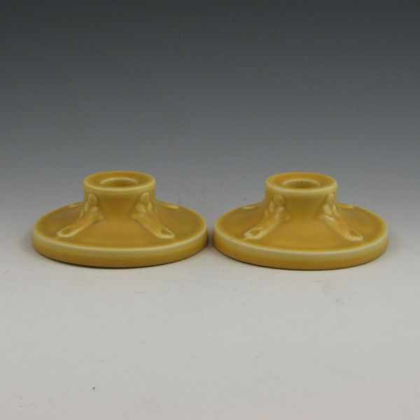 Appraisal: Pair of matte yellow Rookwood candleholders from Marked with Rookwood