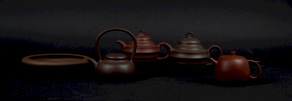 Appraisal: Grouping of Four Yixing Teapots and a Shallow Dish All