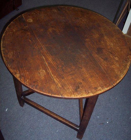 Appraisal: A th Century oak cricket table the circular top cm