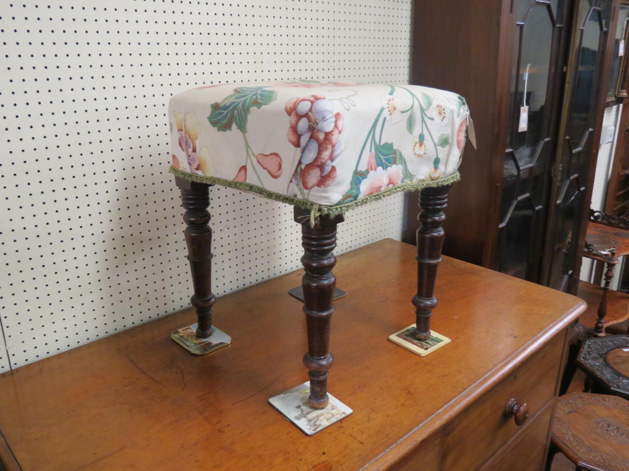 Appraisal: A Victorian mahogany stool upholstered seat on turned and tapering