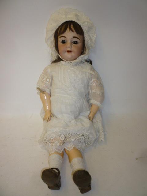 Appraisal: An Armand Marseille bisque head character girl doll with brown