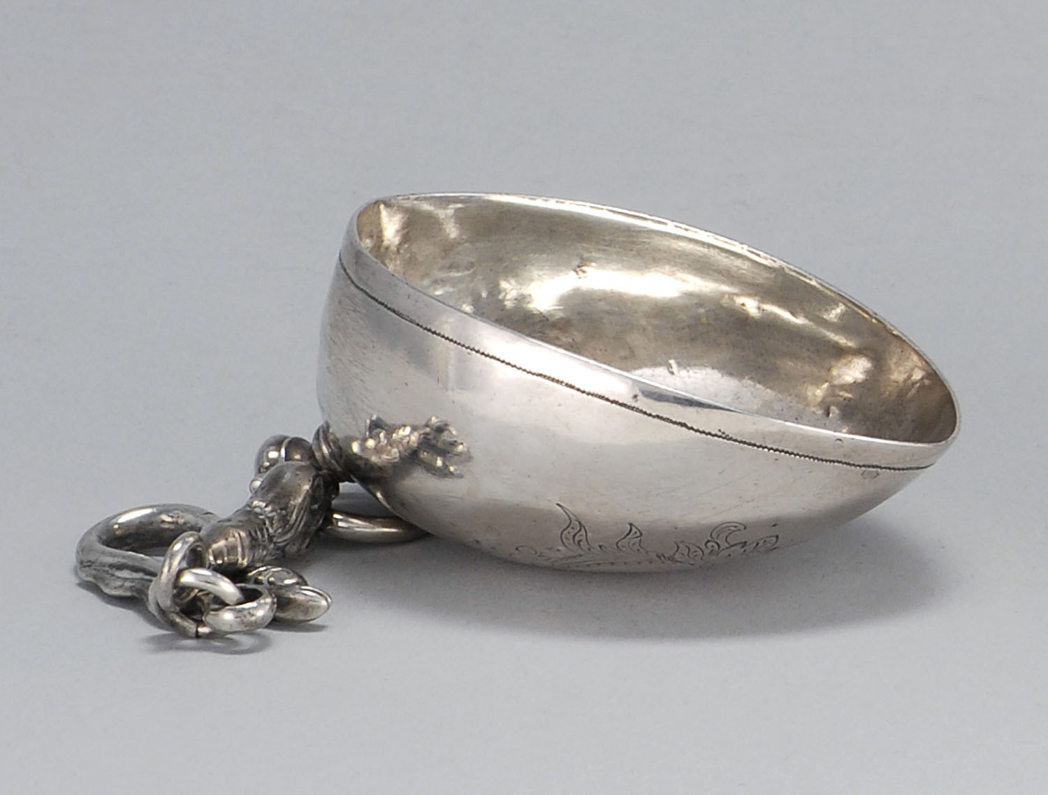 Appraisal: BOLIVIAN SILVER WINE TASTER'S CUP th CenturyIn heart shape with