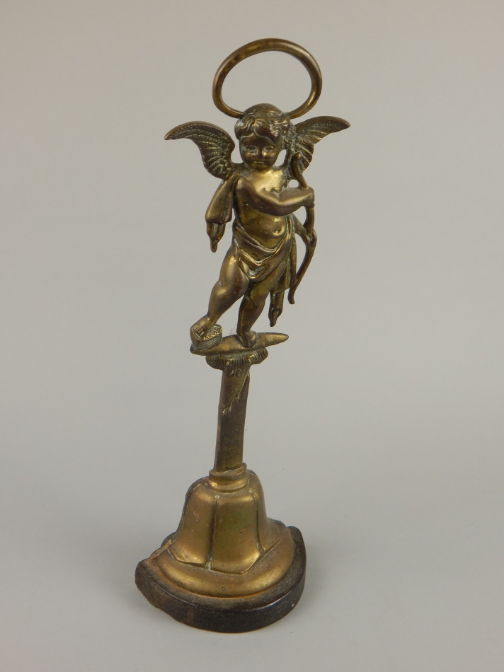 Appraisal: A thC brass doorstop cast in the form of a