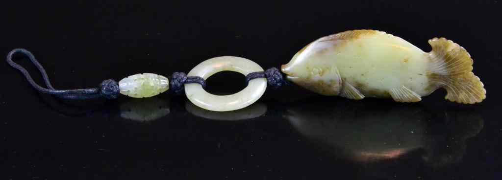 Appraisal: Chinese Jade Carved Fish on Knotted RopeOlive and brown jade