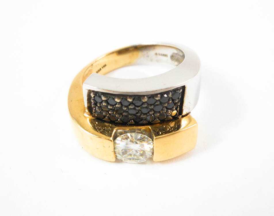 Appraisal: MOISSANITE BLACK DIAMOND AND FOURTEEN KARAT GOLD RING The white