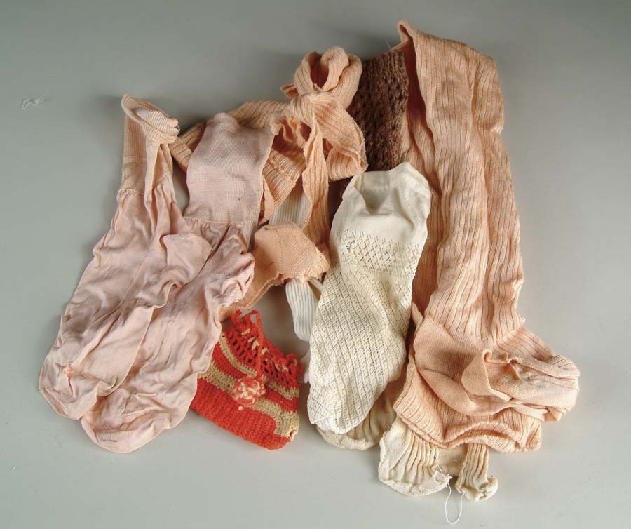 Appraisal: ASSORTED ANTIQUE DOLL SOCKS Lot includes antique pairs singles and