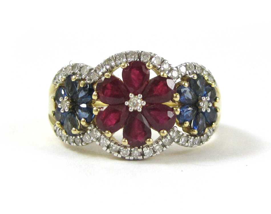 Appraisal: RUBY SAPPHIRE AND DIAMOND FLORAL RING k yellow gold set