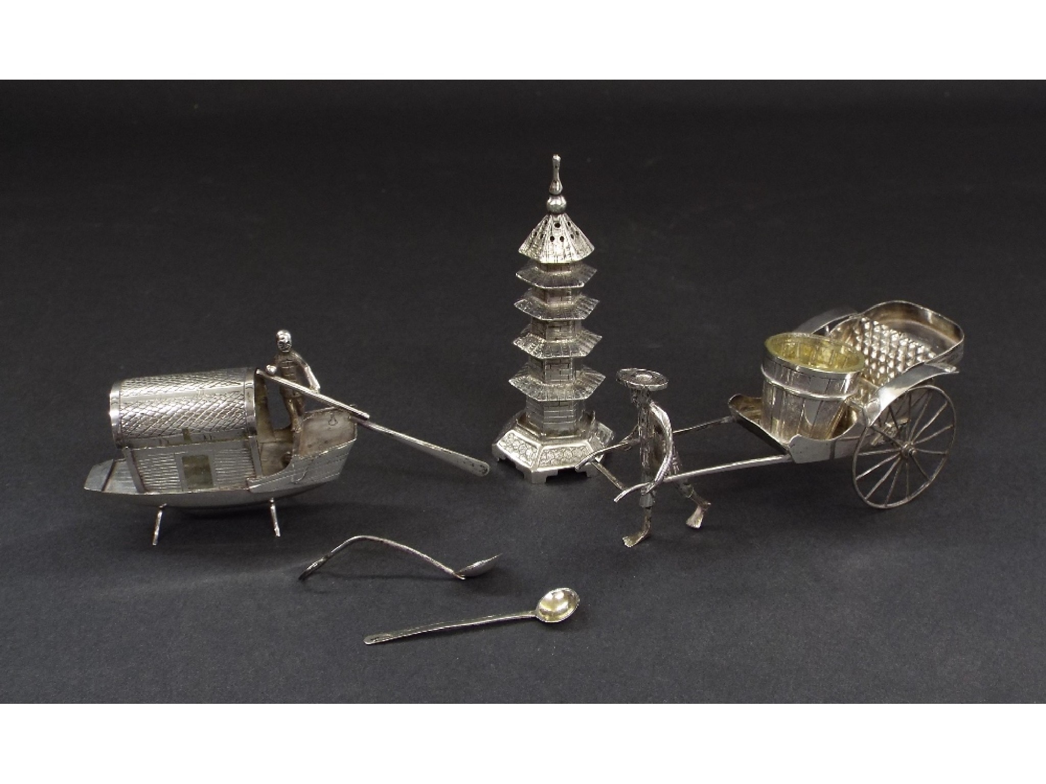 Appraisal: Novelty Eastern white metal cruet set comprising salt in the