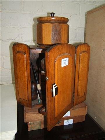 Appraisal: An oak smokers cabinet wide together with an oak tobacco