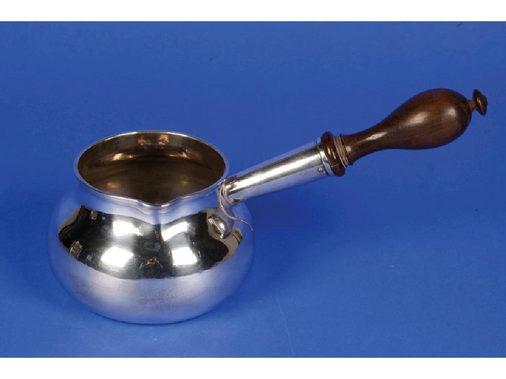 Appraisal: A GEORGE II BRANDY PAN with a turned wooden handle