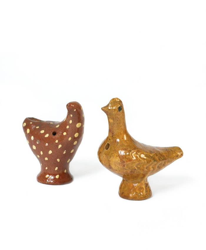 Appraisal: TWO GLAZED REDWARE BIRD WHISTLES The mustard example with impressed