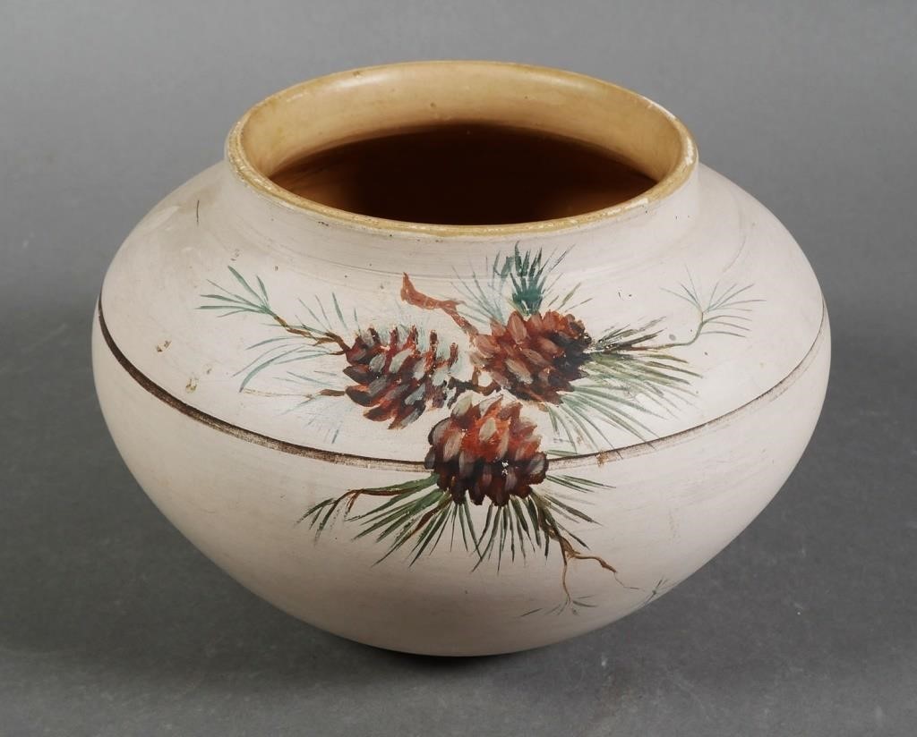 Appraisal: A bowl decorated with pine cones and a circular band