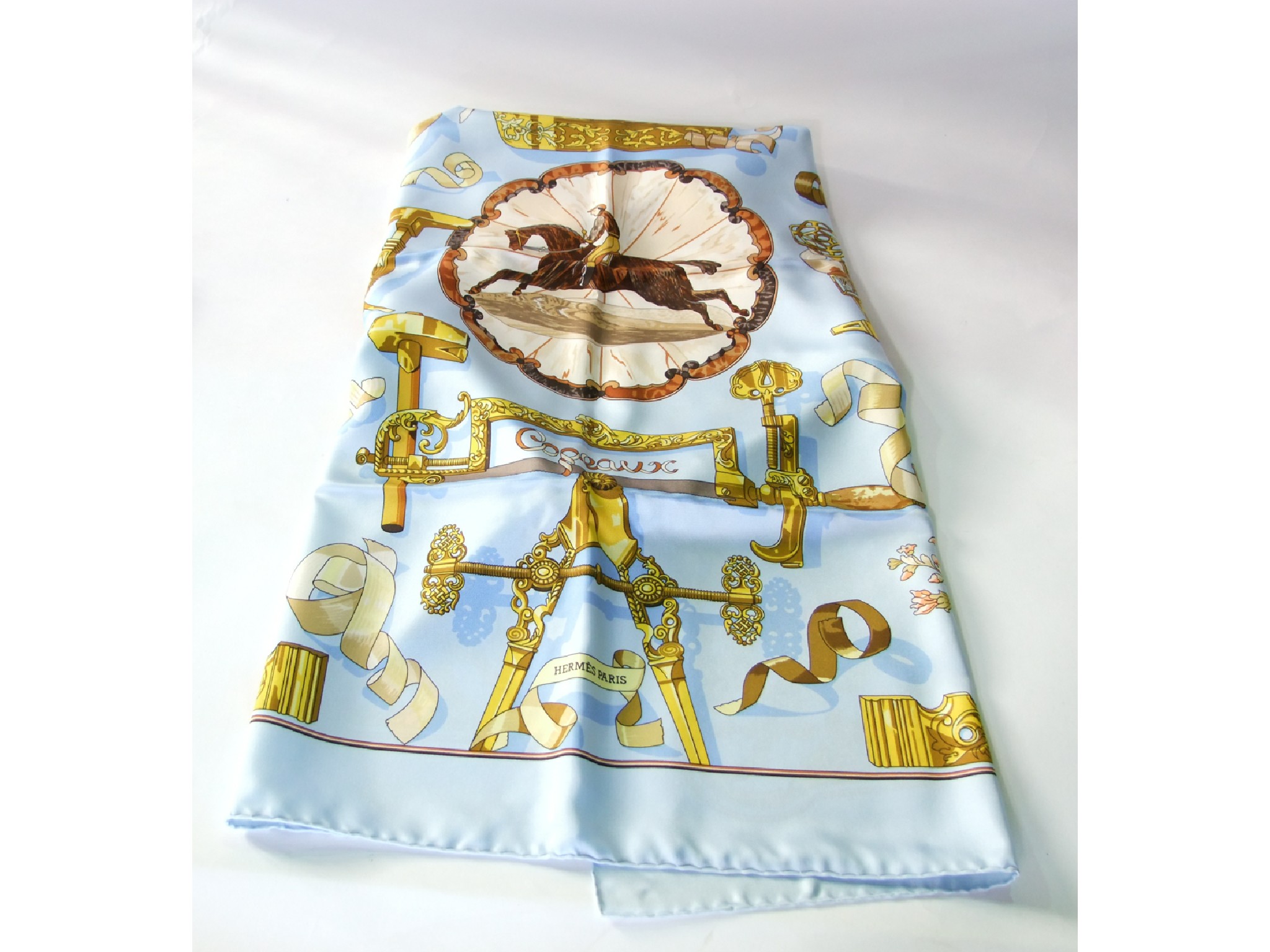 Appraisal: A boxed silk scarf marked Hermes Paris centred with a