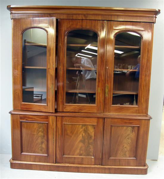 Appraisal: Victorian mahogany bookcase with three glazed doors enclosing three shelves