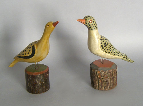 Appraisal: Two carved and painted birds in the manner of Simmons