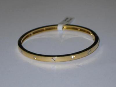 Appraisal: A DIAMOND SET CT GOLD BANGLE of hinged form inset