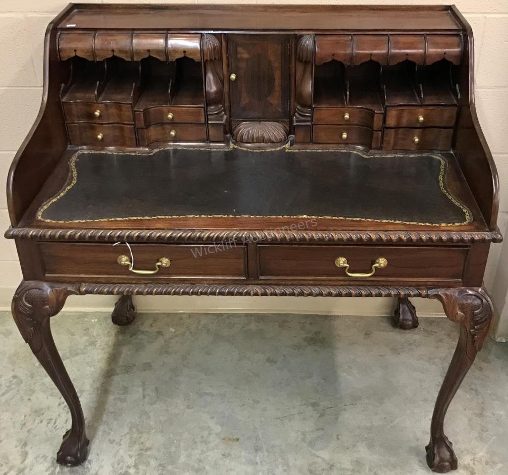 Appraisal: A Chippendale period-style reproduction writing desk leather insert top rope