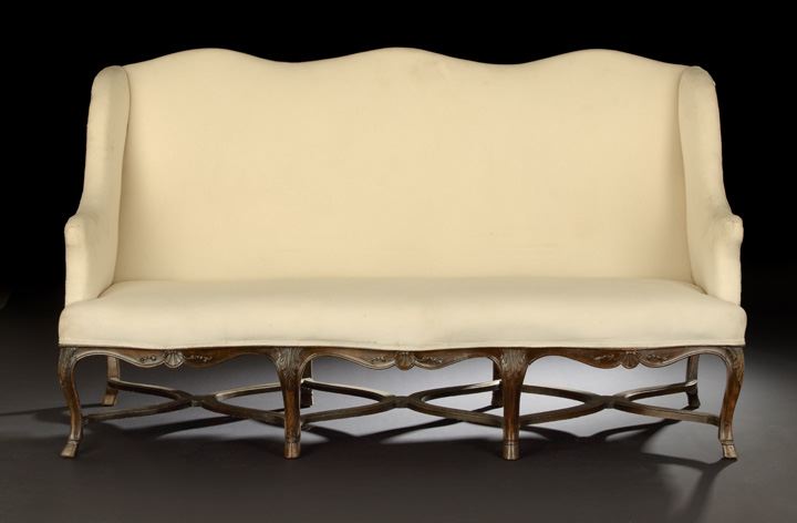 Appraisal: Provincial Louis XV-Style Fruitwood Sofa late th century the padded