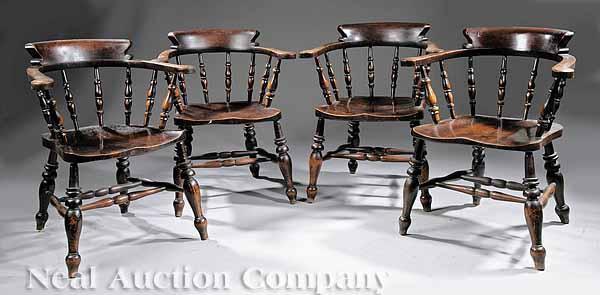 Appraisal: A Suite of Four English Elm Captain's Armchairs mid- th