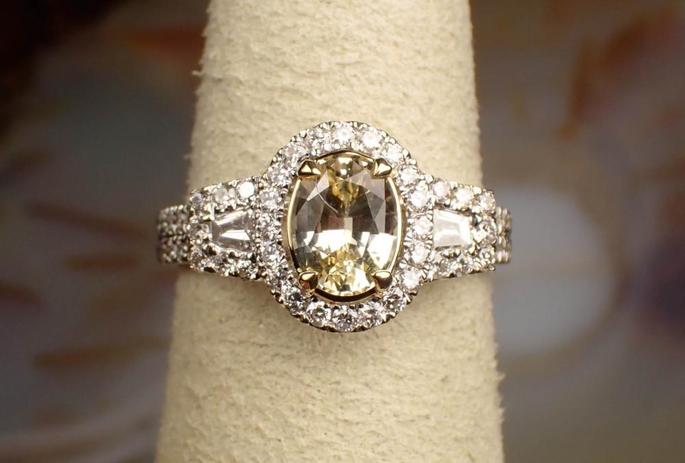 Appraisal: YELLOW SAPPHIRE AND EIGHTEEN KARAT GOLD RING WITH GEM I