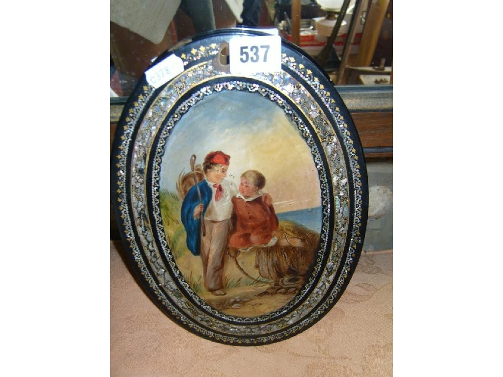 Appraisal: A black ground papier-mache plaque of oval form with painted