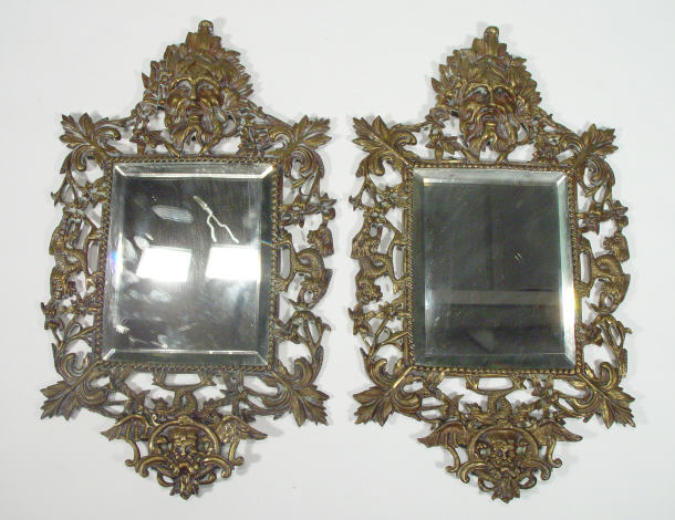 Appraisal: Pair of Victorian brass framed mirrors cast with grotesque masks