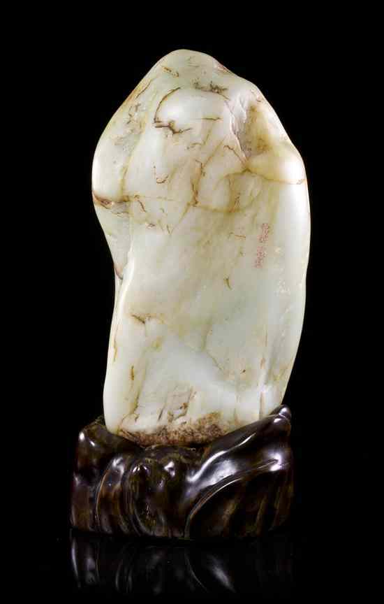 Appraisal: A Jade Boulder Scholar's Rock of opaque white and pale