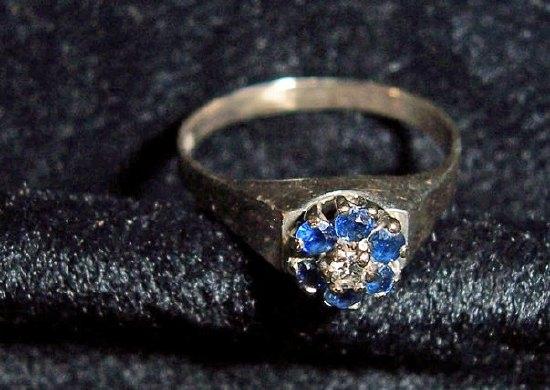 Appraisal: A sapphire and diamond cluster ring in a modern setting